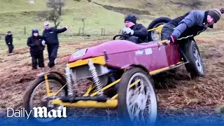 British petrol heads race up muddy hills in Cumbria during unusual motorsport