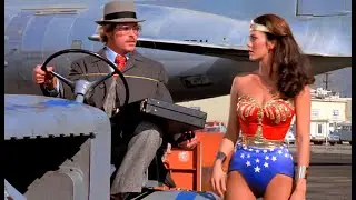 Wonder Woman Running On Runway Tarmac, A Plane, A Building, & Moving Truck 1080P BD