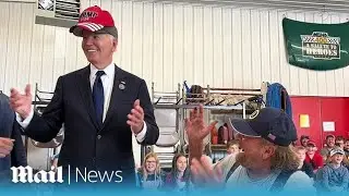 Joe Biden wears Donald Trump's red MAGA hat during bizarre moment at Shanksville fire station