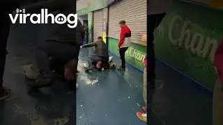 Two Men Slip And Slide On Wet Floors || ViralHog