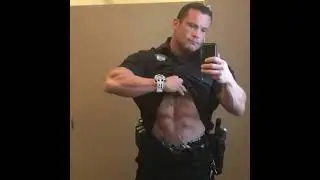 Hot muscle bull muscle hunk in uniform showing off abs