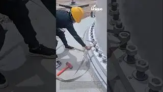 Construction worker installing a wind turbine: wind turbine tutorial