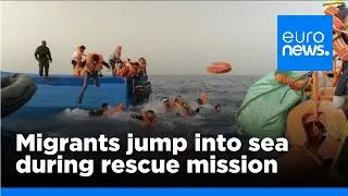 Migrants jump into sea as armed bandits climb onboard their boat during rescue mission | euronews 🇬🇧