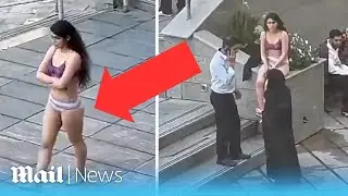 Iranian woman strips to her underwear in protest over hijab laws moments before she is arrested