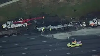 Truck carrying barrels of brake fluid catch fire, explode on I-75 in Cobb County