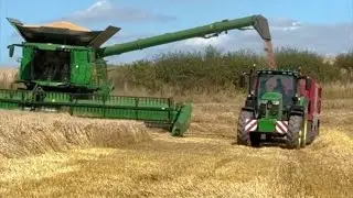 John Deere combine harvesting wheat 