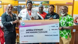 Akeem Receives $100,000 Cheque From THA Division