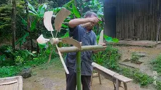 The rural grandfather makes the bird-repelling artifact, his hand and wisdom are admirable