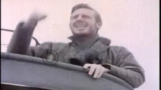 A lookout standing at the conning tower and looks through binoculars aboard a sub...HD Stock Footage