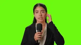 Female reporter reporting with microphone in hand on a chroma green background