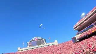 Watch now: The Wings of Blue parachute team drops into Memorial Stadium