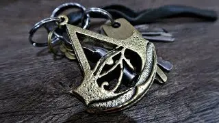 Casting a brass Assassin's Creed Origins Logo Keychain