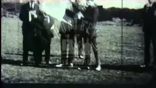 Semaphore being performed by man with semaphore flags.  Film 91080