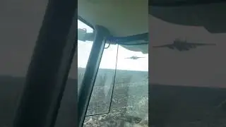 Ukraine attack aircraft Su-25 low pass over tractor driver 