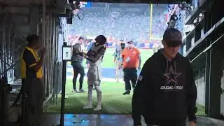 Cee Dee Lamb gives a kid his Cleats after the game