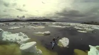 DRONE video of KAYAKER paddling through PACK ICE