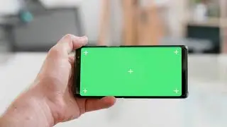 Green Screen | Chroma Key | man hand holding the smartphone horizontally with on watch | 4K | HD