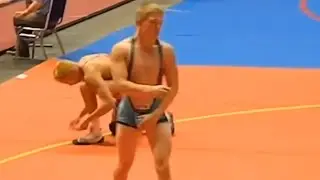 Wrestling in a low cut singlet
