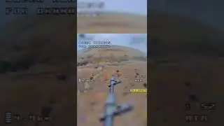 Ukrainian drone equipped with an assault rifle fires at Russian positions from above