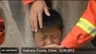 Chinese Boy gets head stuck in guardrail