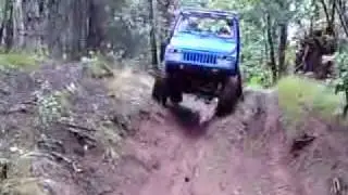 Blue Suzuki 410 named Smurfen driving downhill
