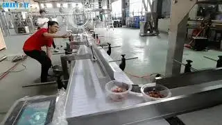 Оборудование для фасовки вареного риса и куры в лотки