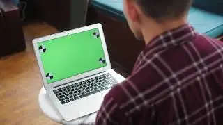 Male using green screen laptop