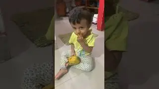 Divam eating Mango