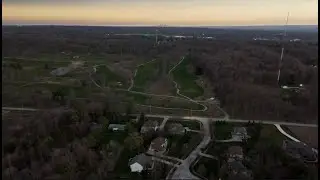 Drone view of eclipse turning landscape dark in suburban Cleveland