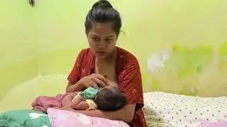 Ibu muda cantik menyusui bayi 24 hari