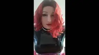 Female mask girl with pink and black live in latex.