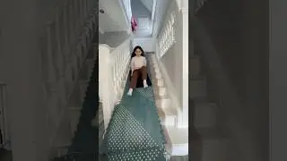 She built a slide on the staircase 😅 
