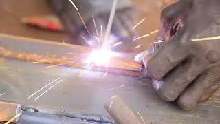 THE PROCESS OF WELDING AND CUTTING METAL USING A WELDING MACHINE AND A GRINDING MACHINE