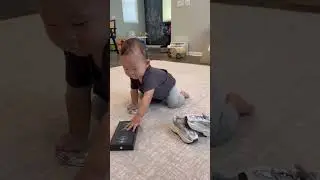 Will baby choose iPhone or $100?