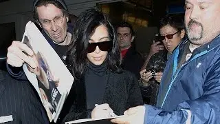 Kim Kardashian Is Bombarded By Paparazzi Upon Returning From London