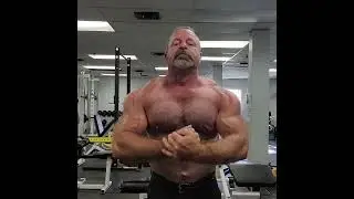 Muscle bear muscle daddy flexing shirtless at the gym