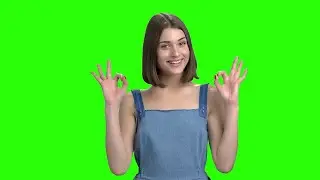 Girl shows approval signs on Green screen - Girl shows approval signs on Chroma key