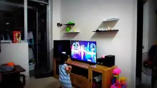 Little daughter having fun with Just Dance game