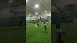 People Shooting Each Other With Arrows