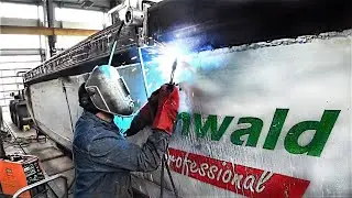 FRAME ADJUSTMENT AND BODY REPAIR OF GRUNWALD SEMI-TRAILER ON STOCK