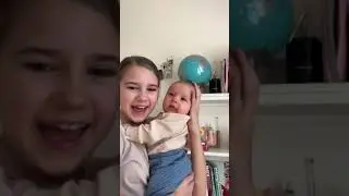 Sister singing for her newborn baby brother