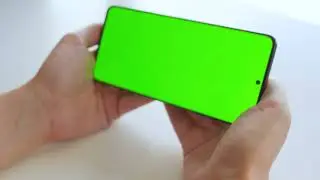 Green Screen | Chroma Key |  female hands using a smartphone with a green screen | 4K | HD