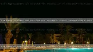 Night swimming pool with lighting and palm trees in luxury time lapse