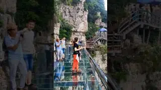 Massive Rock Falls Next to Tourists on Glass Bridge!