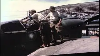 Japanese soldiers look into cockpit of captured American Curtiss P-40 fighter pla...HD Stock Footage