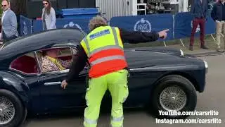 Supercars and classics leaving *Salon Priv* supercar event meet