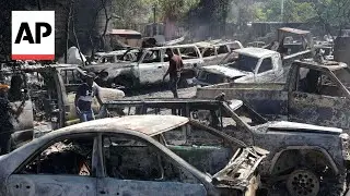 Haiti gang members set fire to garage in Port-au-Prince