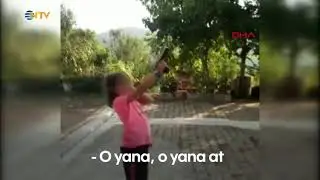 NTV | Küçük kıza zorla ateş ettirdi