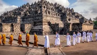 Aerial view of Borobudur, set against a misty sunrise in the Indonesian jungle