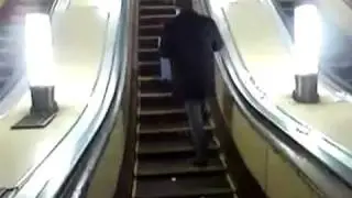 Drunk Russian falls down Escalator